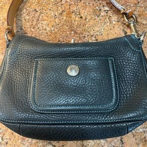 Coach handbag in black with brown strap and blue satin inside.